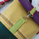 Mochila média textura amarelo claro com bordados,  topo roxo, fundo verde escuro | Joana Candeias