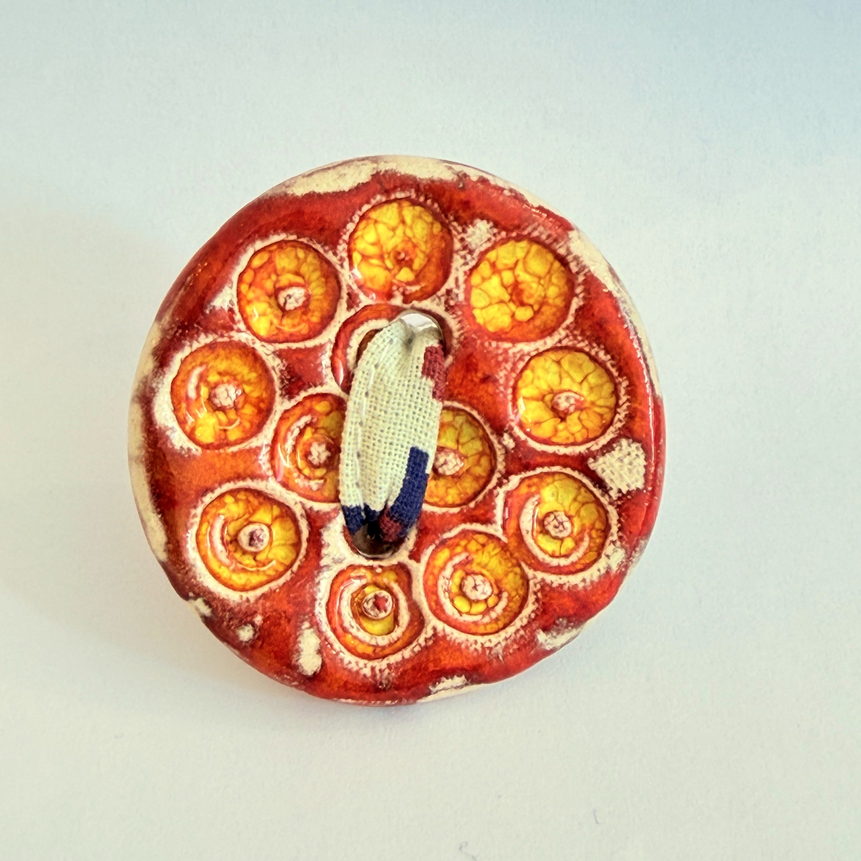 Pregadeira Botão laranja | Pássaro de Seda